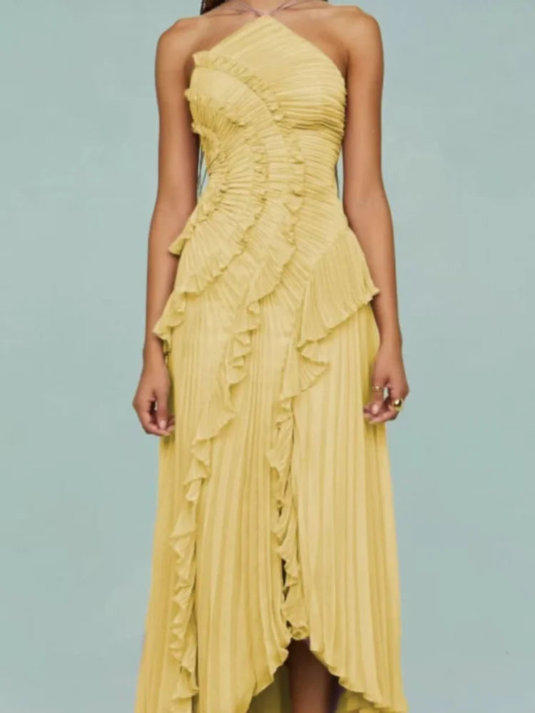 Yellow ruffled dress on a light blue background