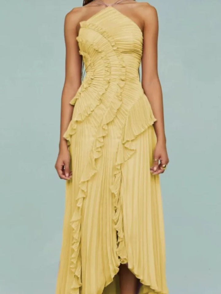Yellow ruffled dress on a light blue background