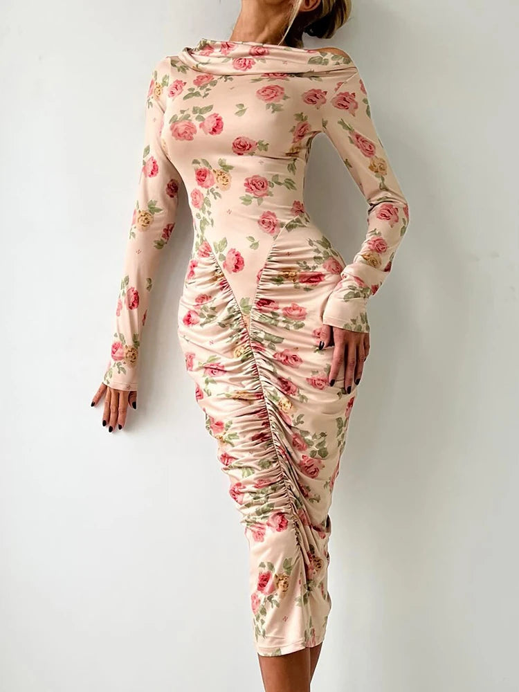 Yesenia Midi Dress featuring a floral design, long sleeves, and a backless midi dress silhouette.