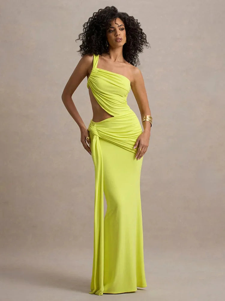 A model wearing a neon yellow one-shoulder maxi dress with a ruched design and a cut-out at the hollow of the neck.
