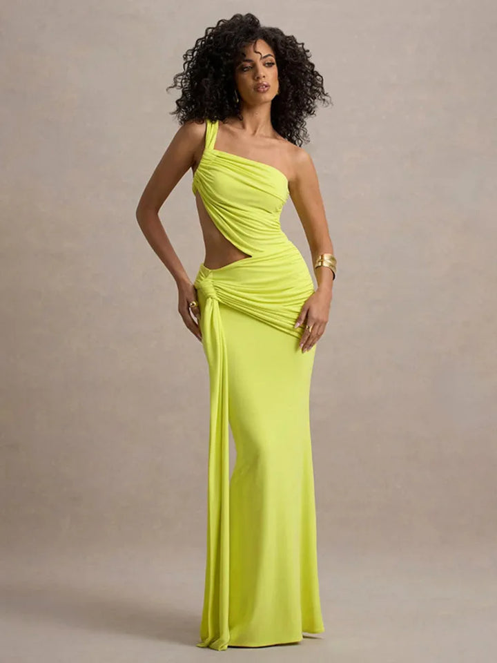 A model wearing a neon yellow one-shoulder maxi dress with a ruched design and a cut-out at the hollow of the neck.