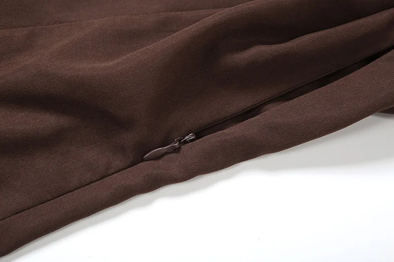 Close-up of a brown fabric with a zipper on a white background