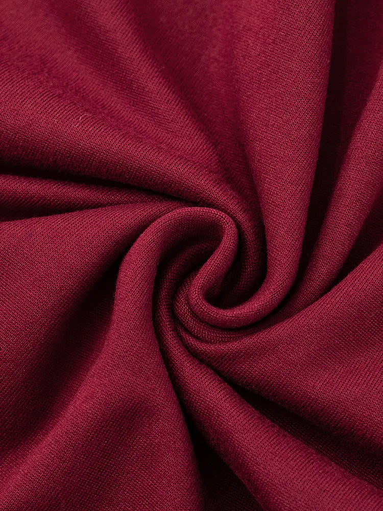 Close-up of dark red fabric with folds