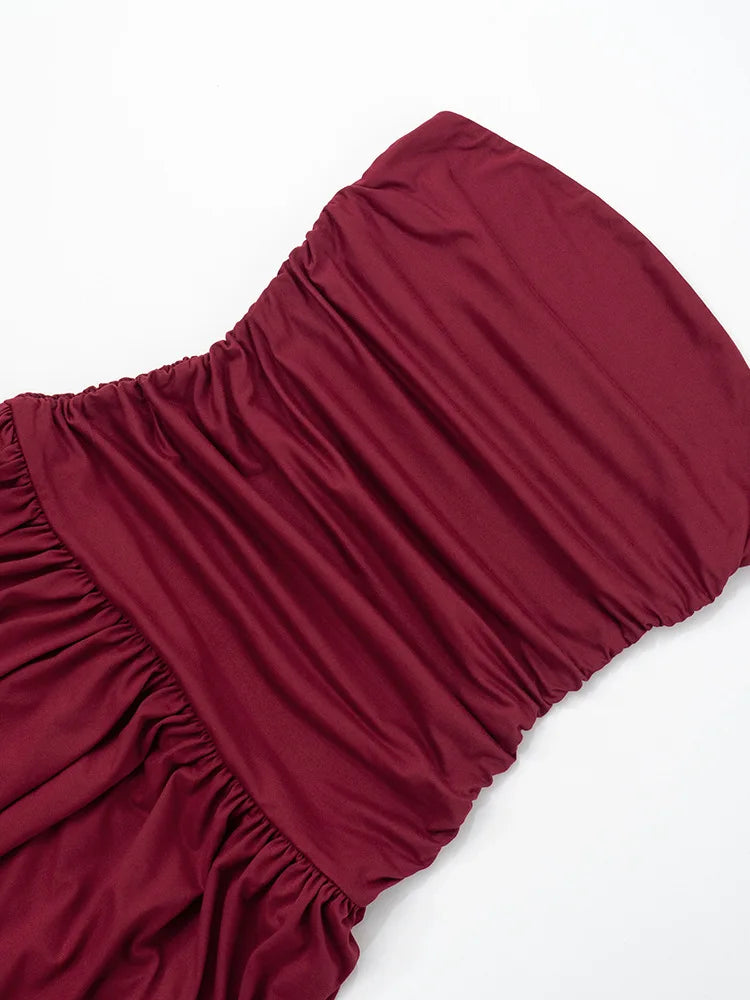 Maroon fabric with ruffled edge on a white background