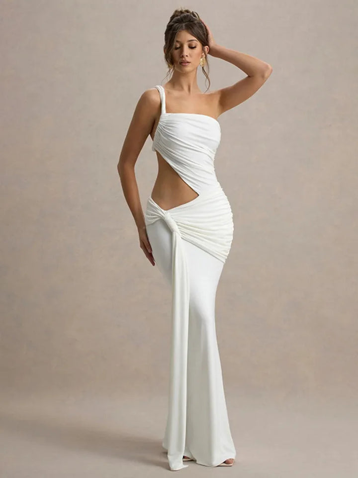 A model wearing white one-shoulder maxi dress with a ruched design and a cut-out at the hollow of the neck.