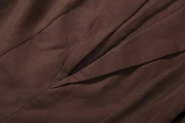 Close-up of brown fabric with folds