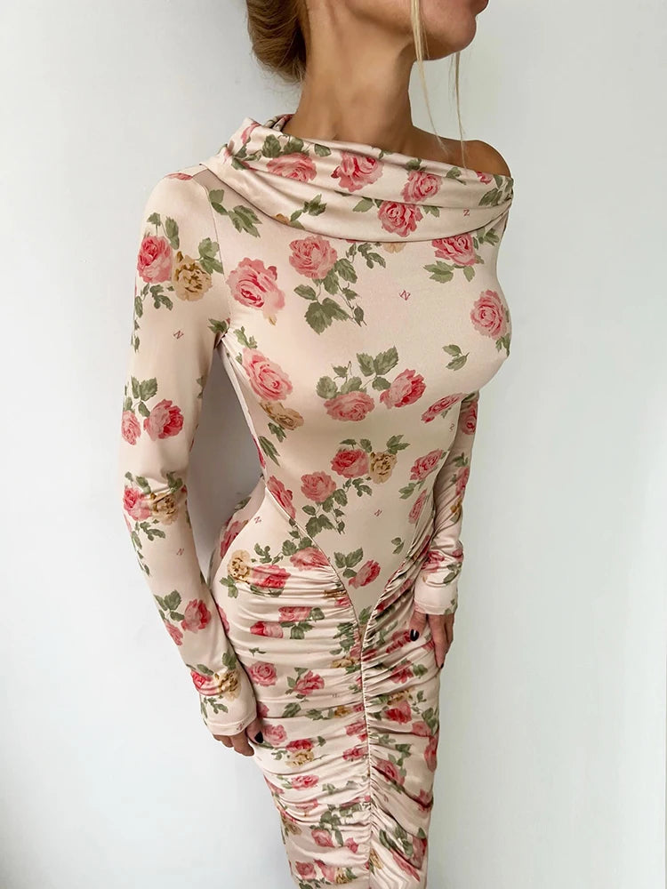 Yesenia Midi Dress, a backless midi dress with floral design, ruched silhouette, and long sleeves for elegant night outings.