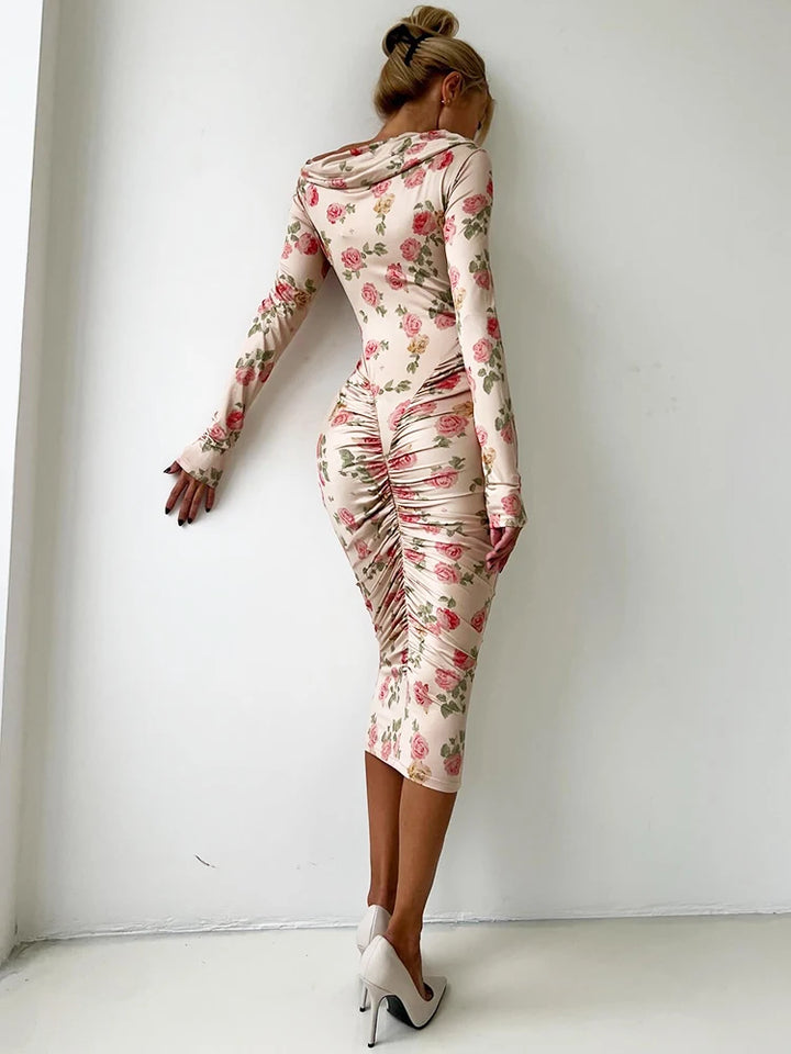 Backless midi dress with floral pattern, ruched bodycon silhouette, long sleeves, and diagonal collar.