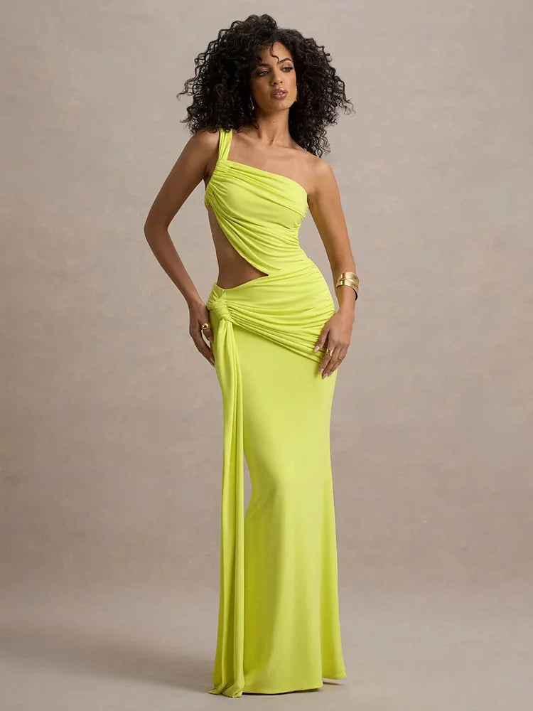 A model wearing a neon yellow one-shoulder maxi dress with a ruched design and a cut-out at the hollow of the neck.