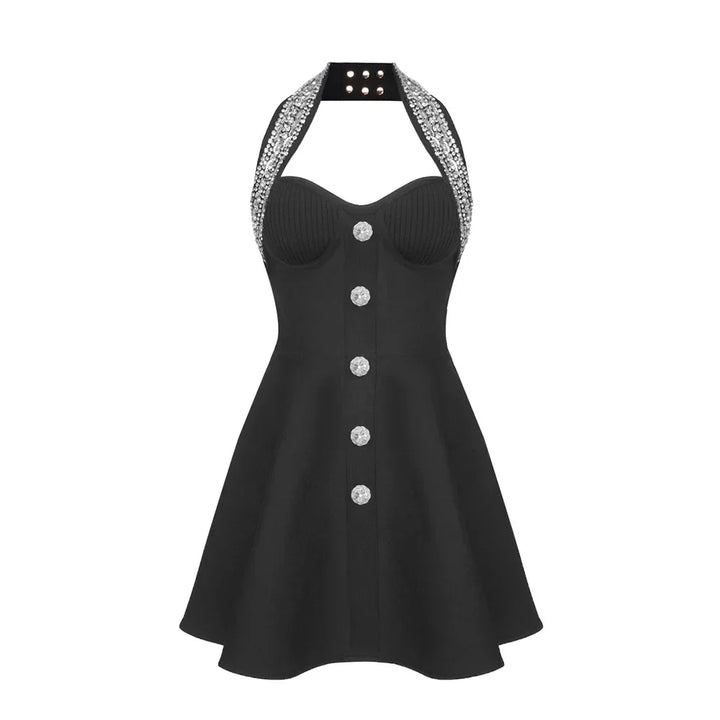 Black dress with silver buttons and embellished straps on a white background