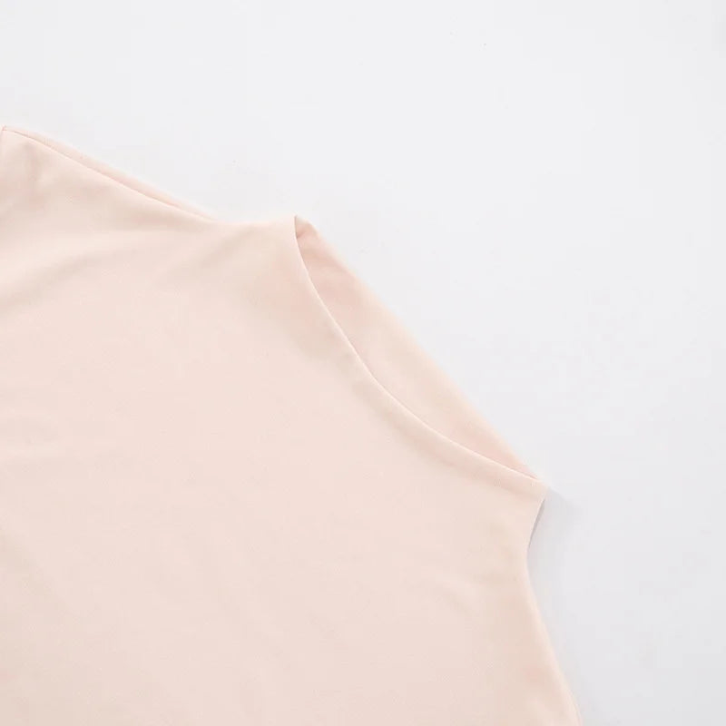 Light pink sleeveless top on a light gray background