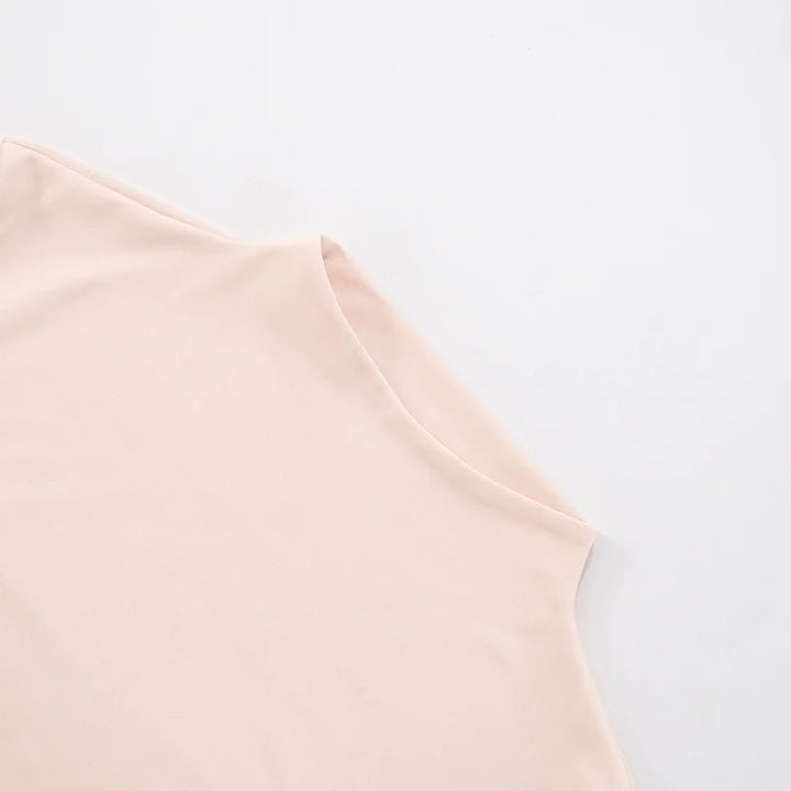 Light pink sleeveless top on a light gray background