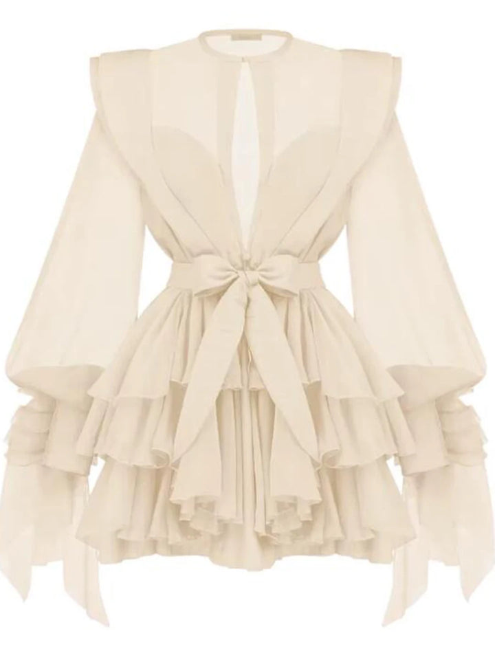 Beige ruffled dress with a tie detail on a white background