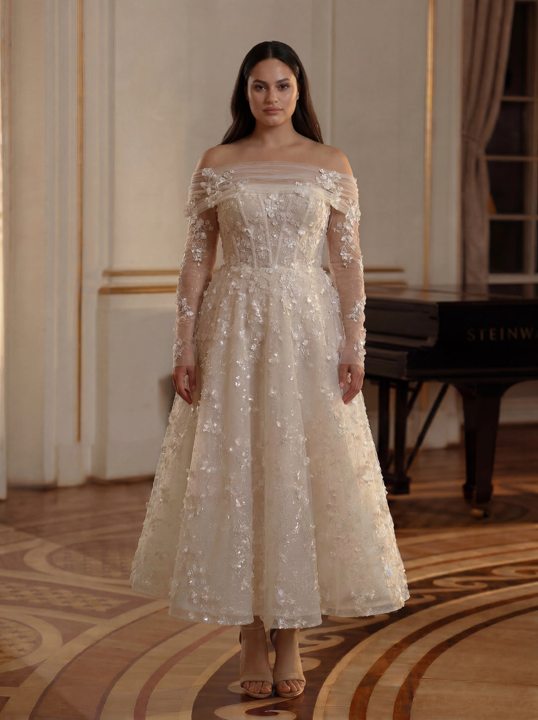 Woman in a white off-shoulder dress standing in an elegant room with a piano.