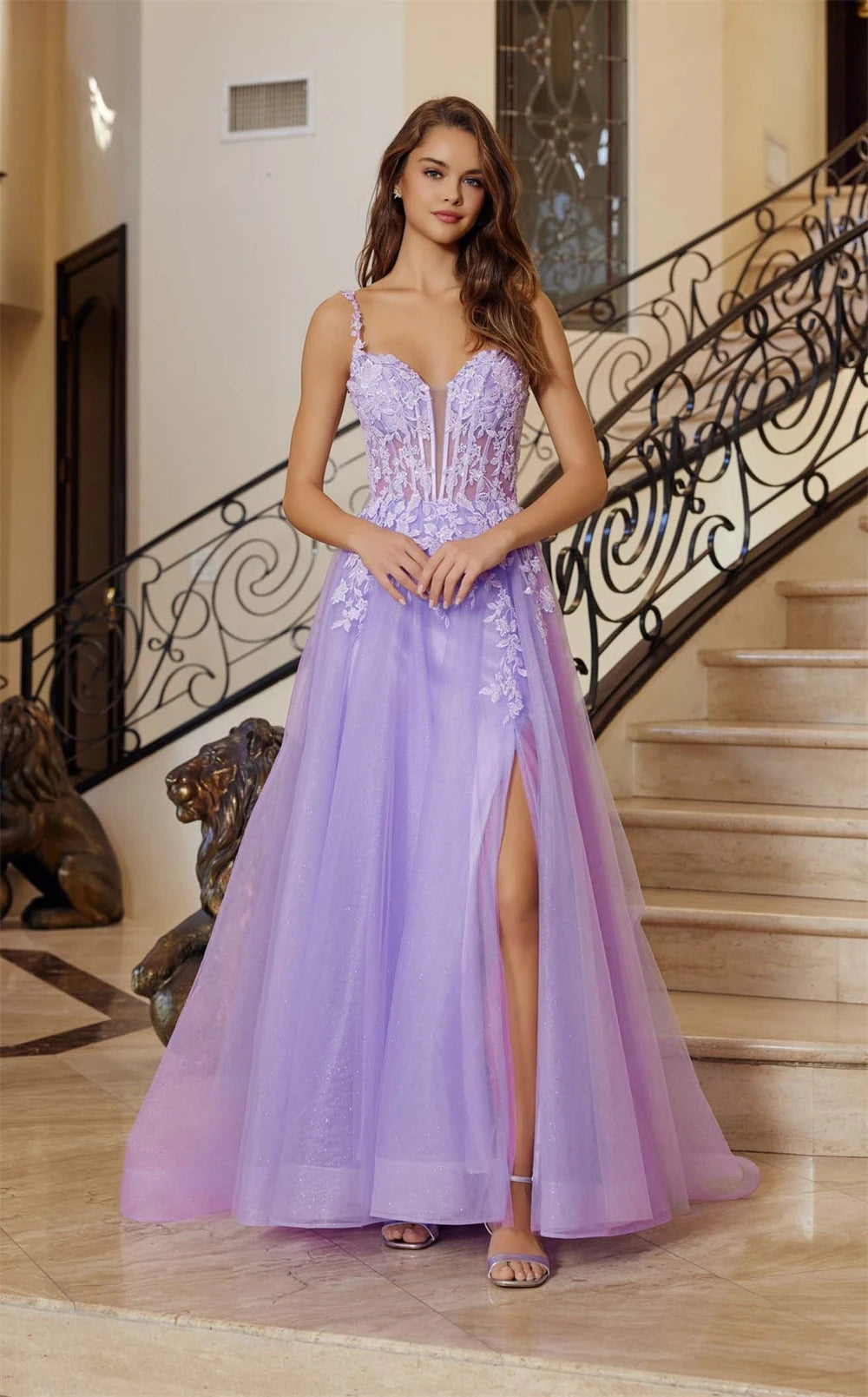 Woman in a lavender evening gown standing in front of a staircase.
