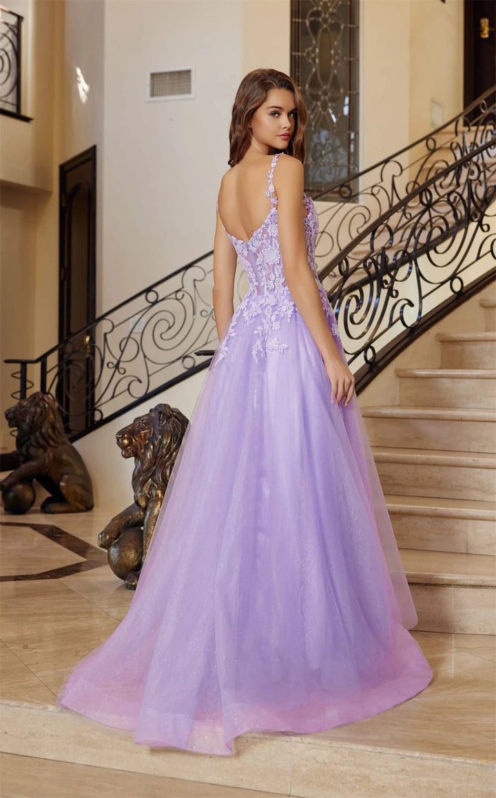 Woman in a lavender evening gown standing in a elegant interior setting with staircase.
