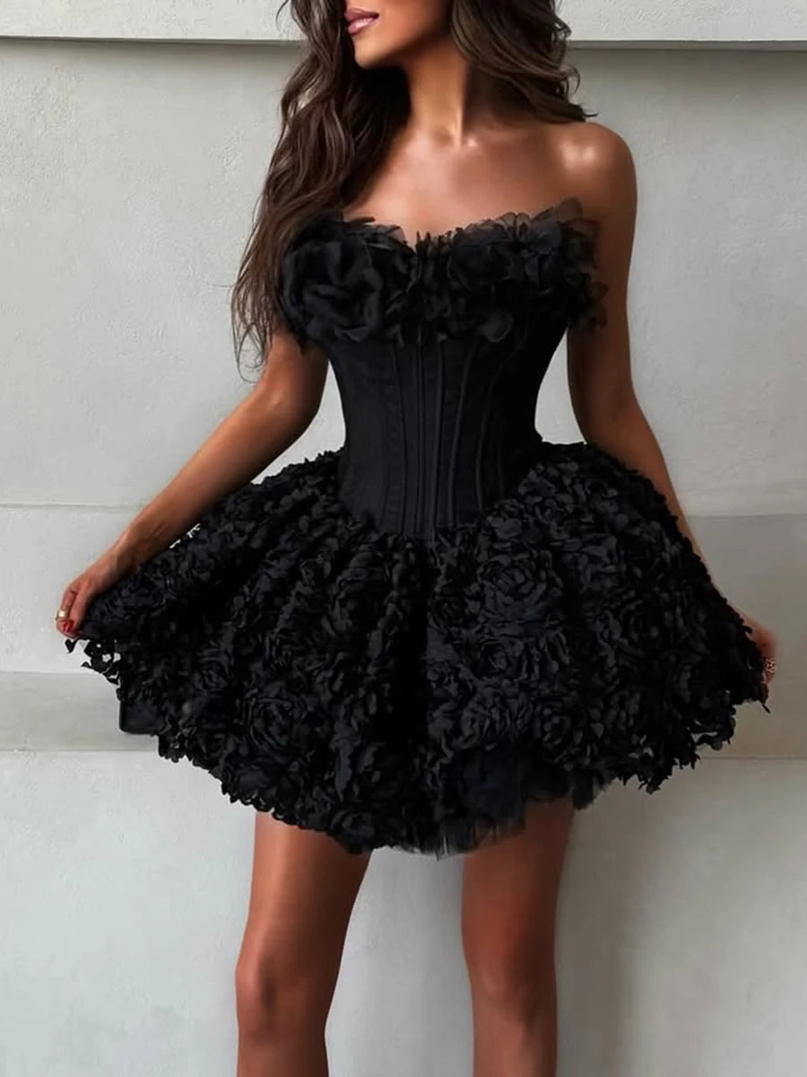 Black floral dress worn by a model against a neutral background