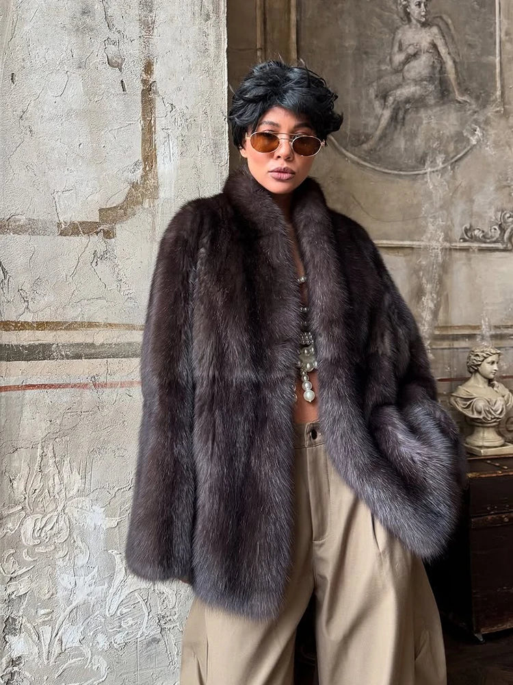 Person wearing a fur coat in an artistic setting