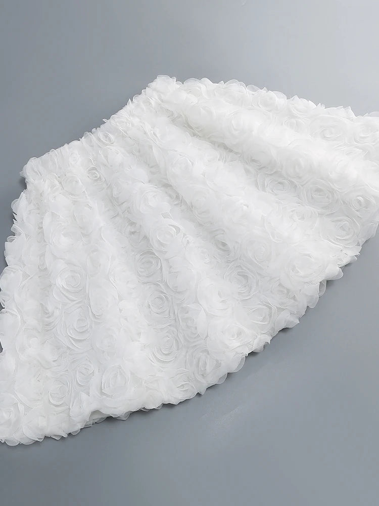 White floral table runner on a gray background