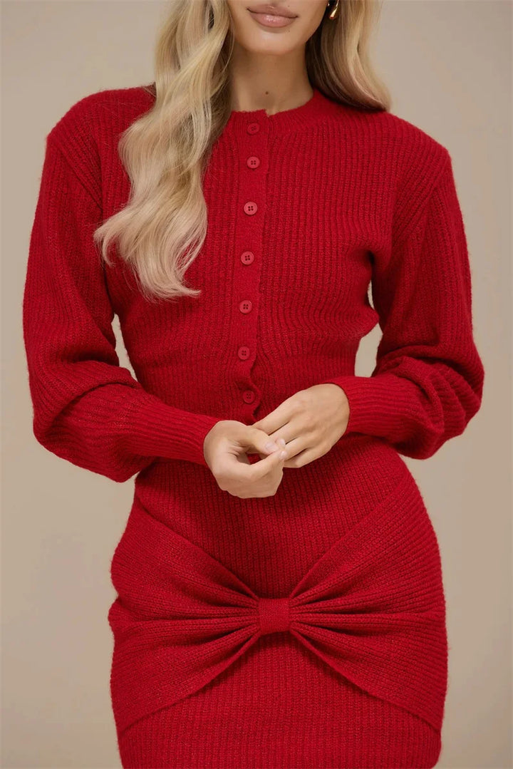 Red knitted dress with a large bow detail on a beige background