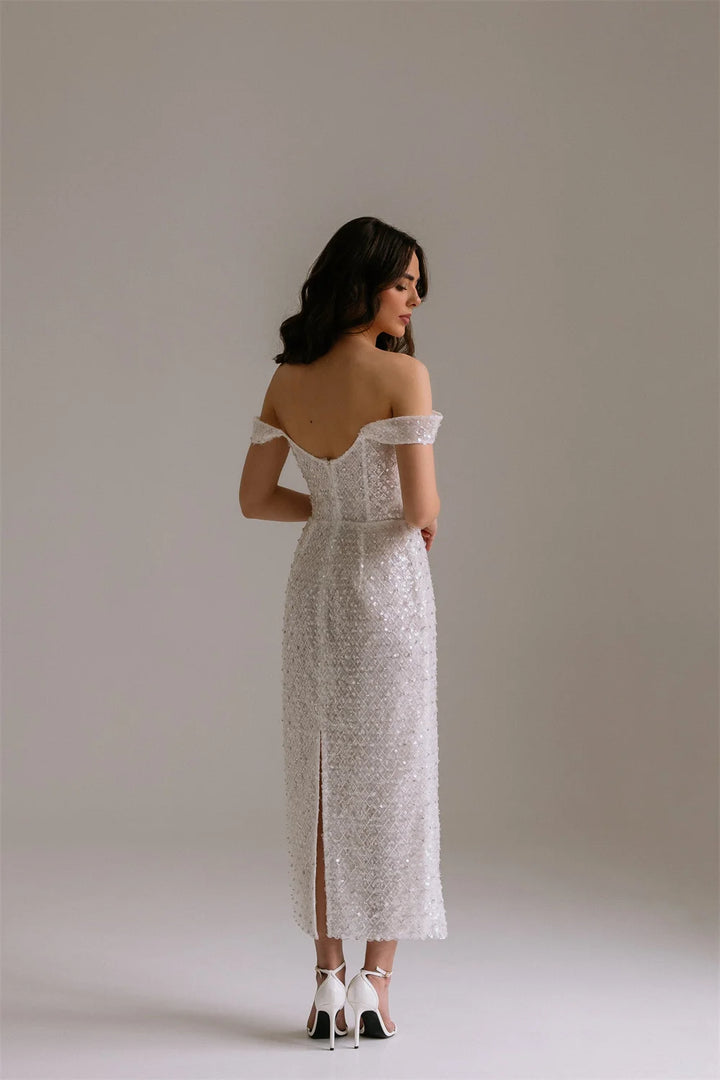 Maxi Dress epitomizes bridal elegance with its lustrous ivory sequin embellishment and refined silhouette