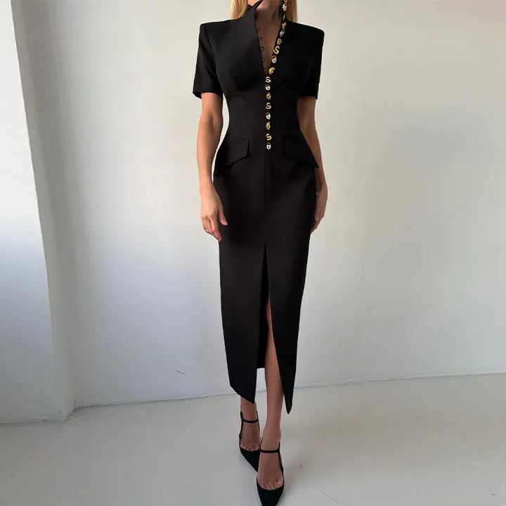 Black dress with gold buttons worn by a model against a white background