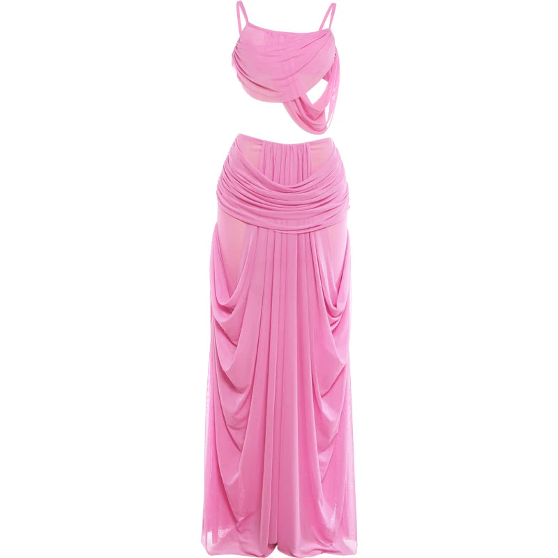 Pink two-piece dress with top and flowing skirt on a white background