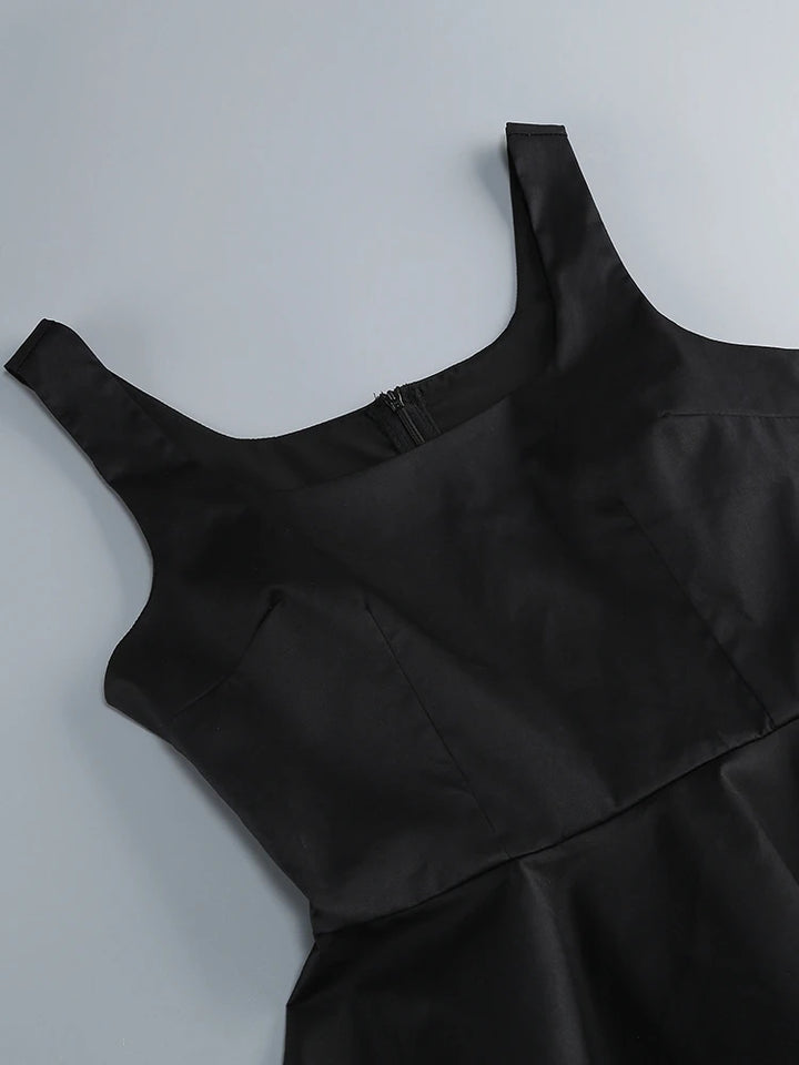 Black dress on a light gray background