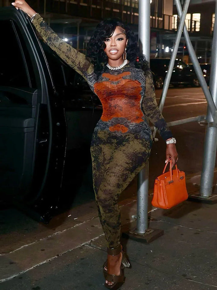 Woman in a patterned outfit standing in a bathroom