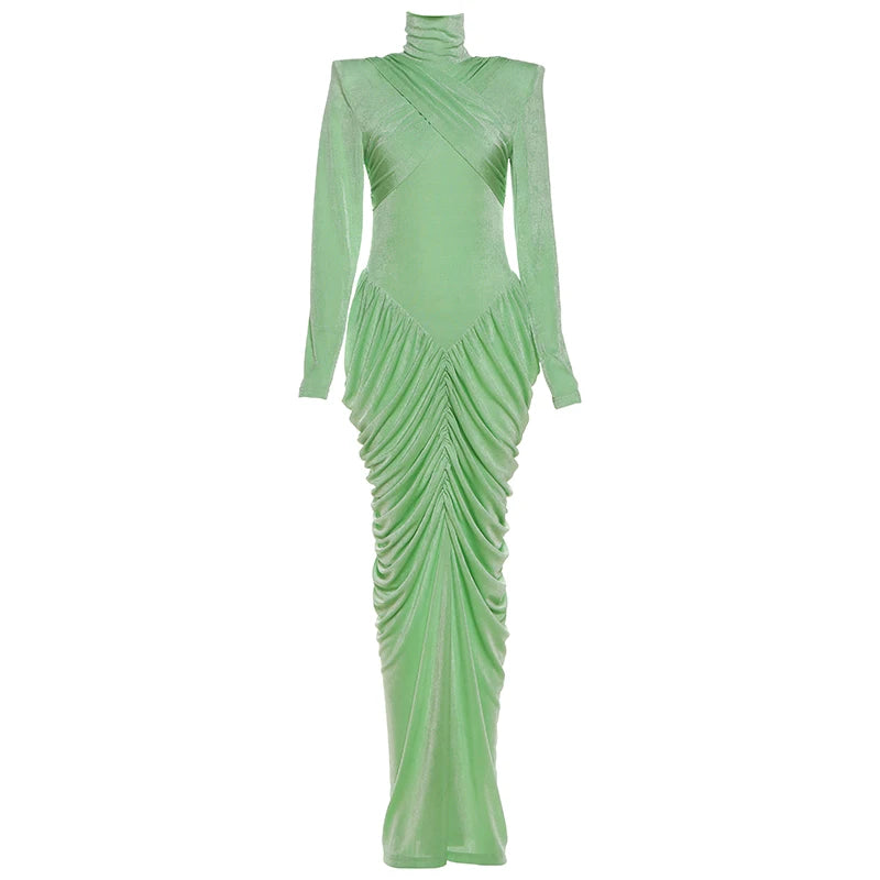 Green evening gown with long sleeves on a white background