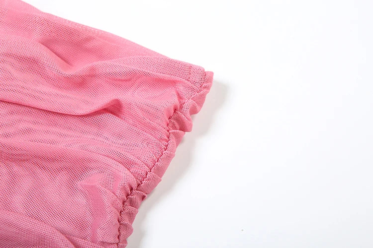 Close-up of pink fabric on a white background