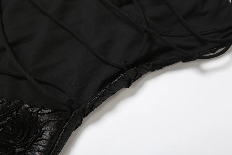 Black fabric with floral details on a white background