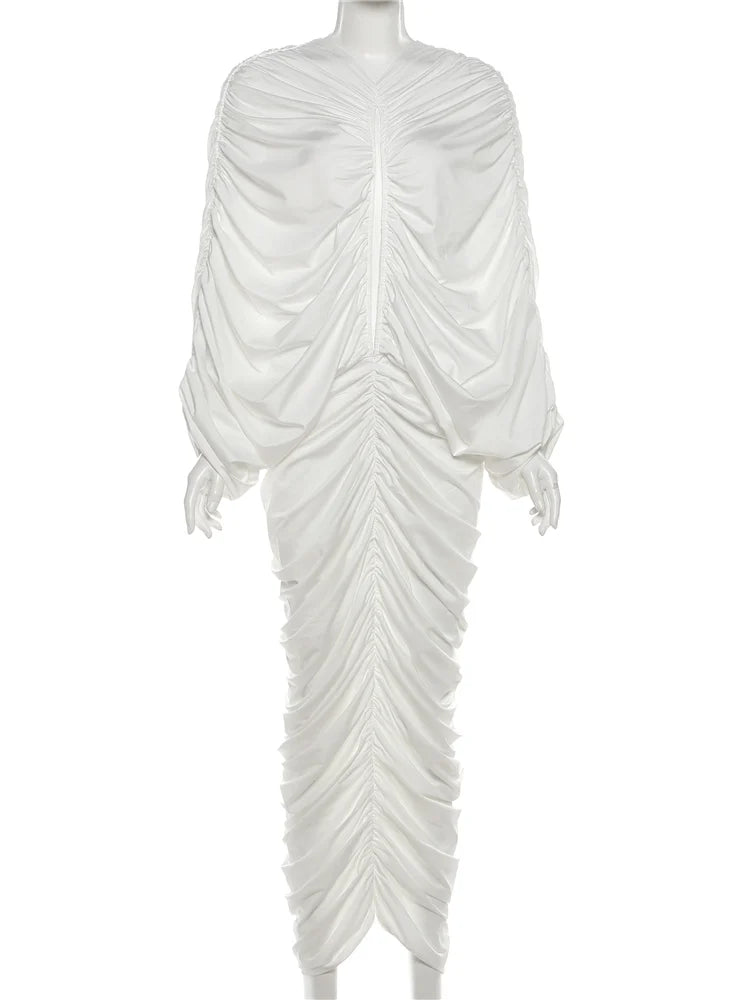 White draped dress on a mannequin against a white background