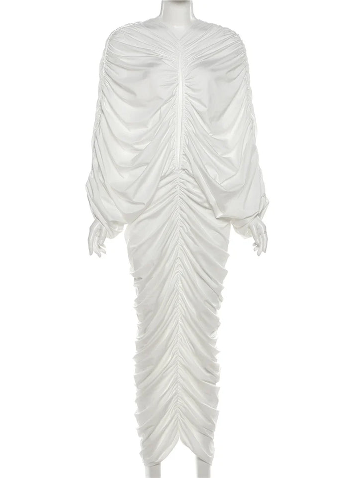 White draped dress on a mannequin against a white background