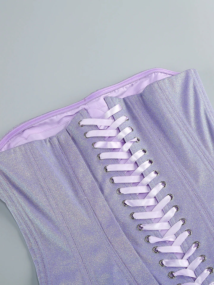 Purple strapless dress with ruffled skirt on a white background