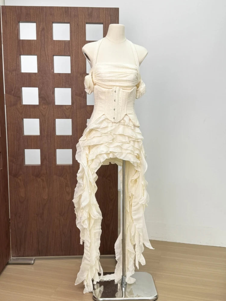 White dress on a mannequin against a wooden panel background