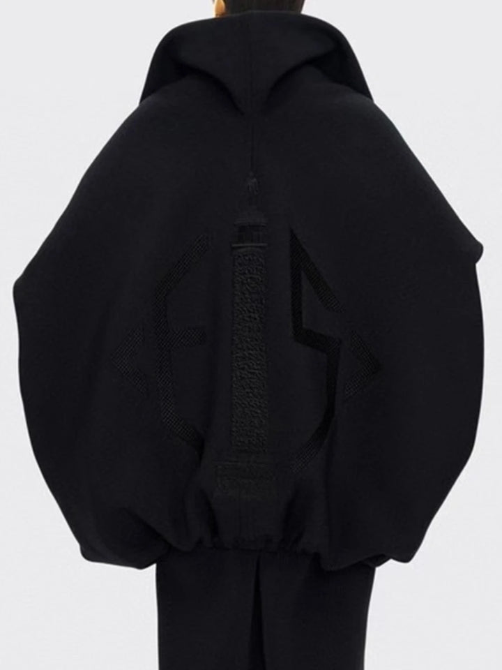 Black hoodie on a mannequin against a white background