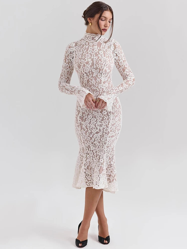 Woman wearing a white lace dress on a light gray background