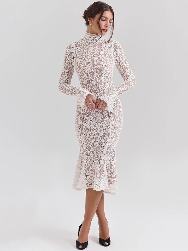 Woman wearing a white lace dress on a light gray background