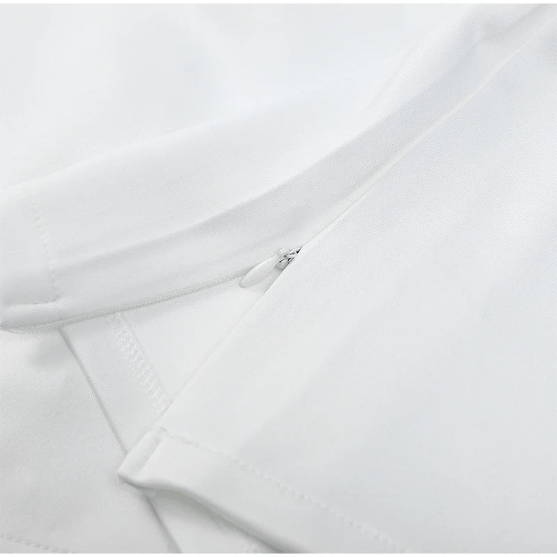 Close-up of a white shirt with a collar and sleeve
