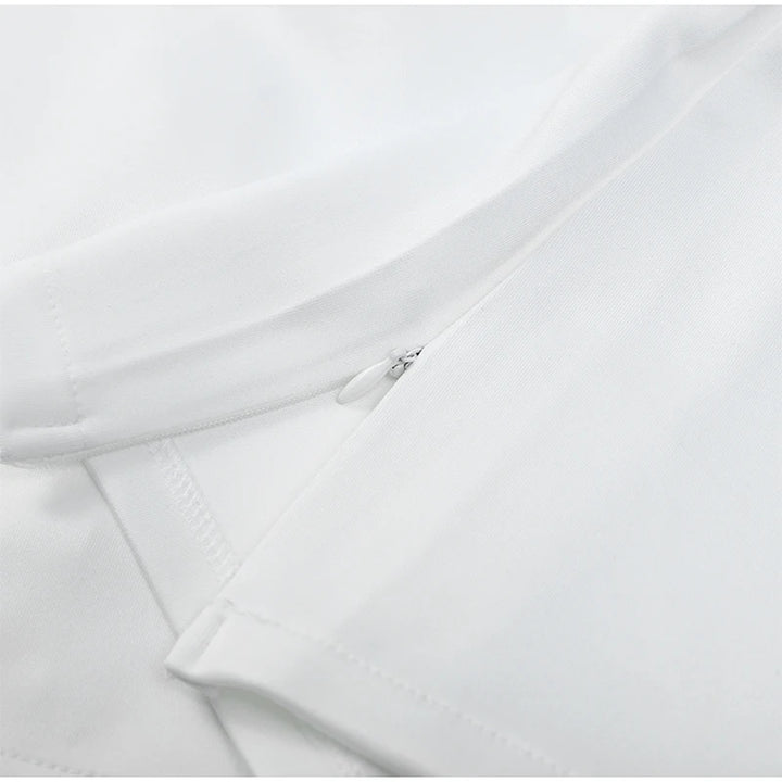Close-up of a white shirt with a collar and sleeve