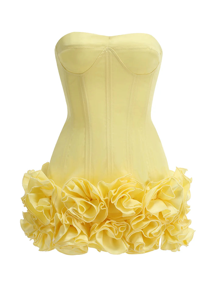 Yellow strapless dress with ruffled skirt on a white background