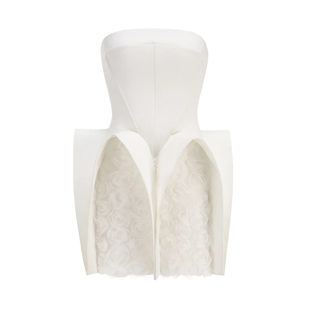 White strapless dress with textured bodice on a white background