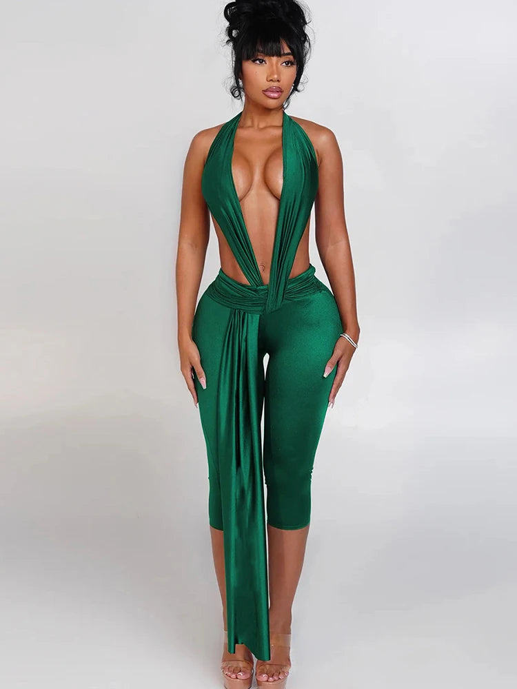 Green jumpsuit with a deep neckline on a white background