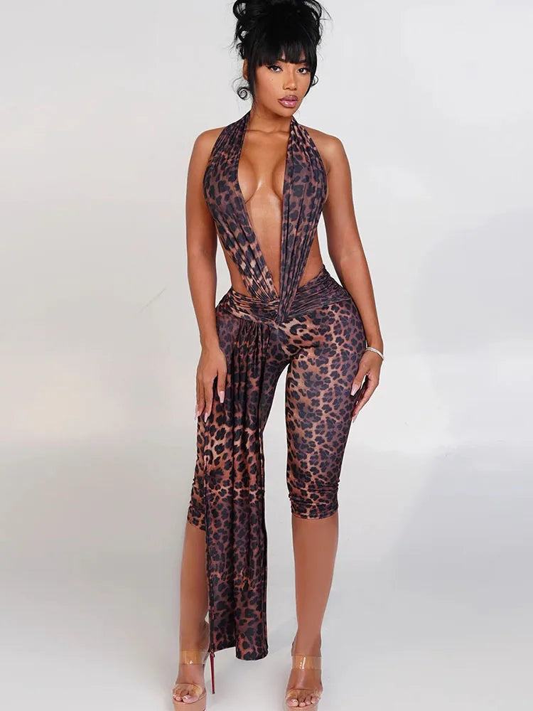 Woman wearing a leopard print jumpsuit on a white background