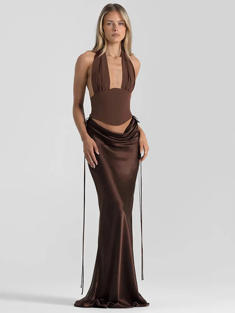 Woman wearing a brown evening gown on a light gray background