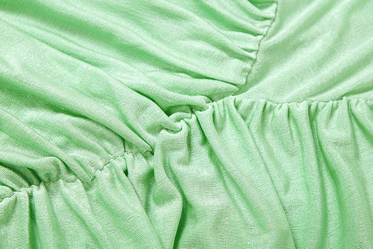 Close-up of green fabric with ruffled texture