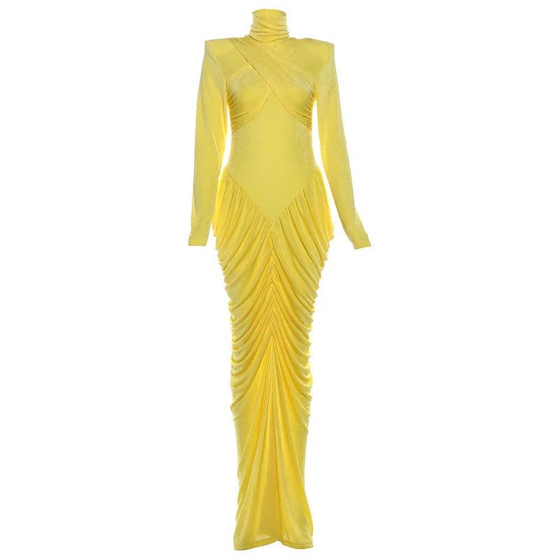 Yellow evening gown with long sleeves on a white background