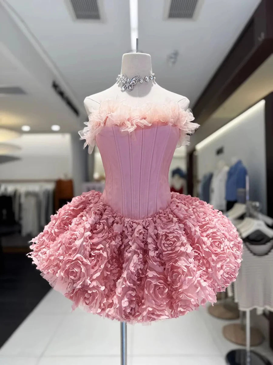 Pink dress on a mannequin in a store setting