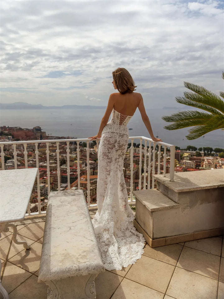 Maxi Dress is a striking off-white lace wedding gown designed for the modern bride seeking timeless elegance with contemporary edge